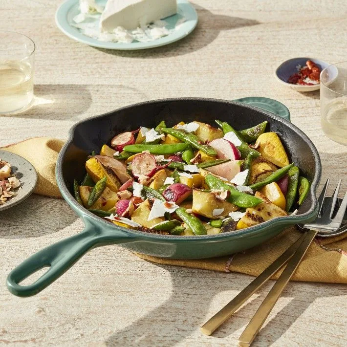 Le Creuset enameled cast iron skillet on induction cooktop